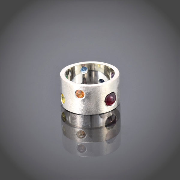 Wide frosted silver band with multi-coloured stones