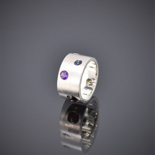 Wide frosted silver band with multi-coloured stones, amathyst topaz showing