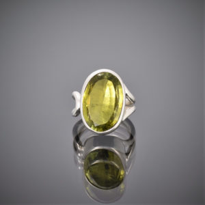 Chunky oval peridot and silver wire ring. Peridot set in rubover setting.