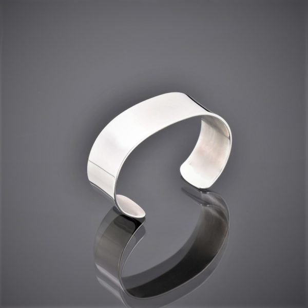 Side view of wide polished solid silver cuff