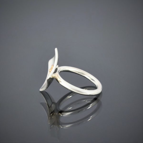 Profile view of a square concave brushed silver ring showing the round silver wire shank