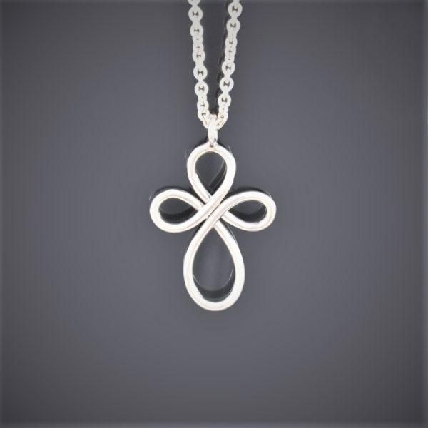 A single piece of round silver wire formed into an infinity cross on silver chain
