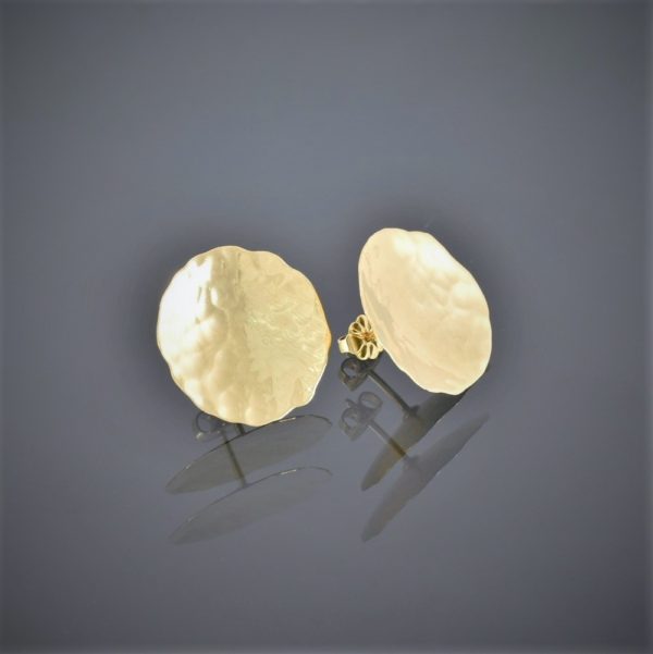 Front view of a pair of 18ct yellow gold stud earrings. The gold is thin, slightly concave with a beaten finish