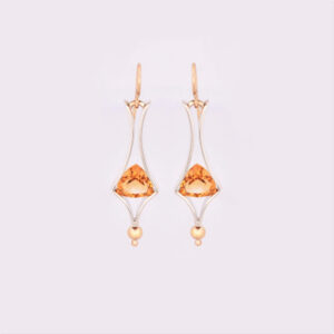 A pair of silver and 9ct yellow gold citrine dangle earrings. The trillion cut citrines are tension set in silver. Front view