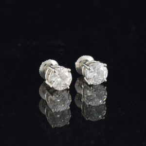 Right side view of a pair of platinum lab grown diamond stud earrings